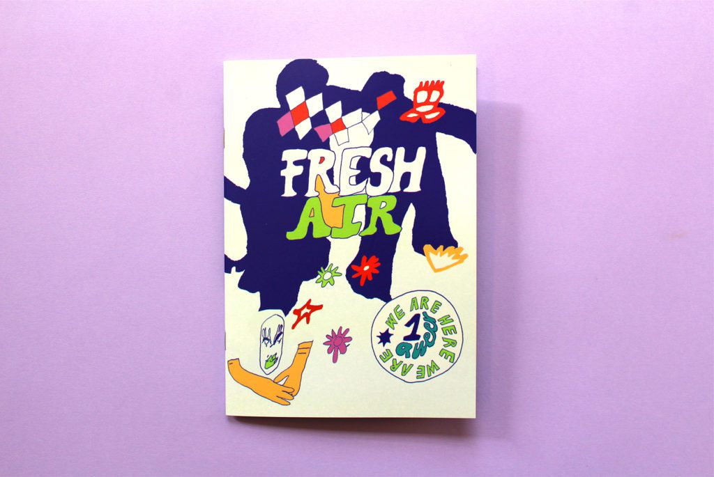 An A5 zine with a cream cover sits on a lilac surface. The cover is covered in a flowing line drawing with blue, lime and yellow fill that seems to depict two abstract figures,
