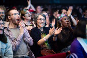 Crowd shot of smiling people