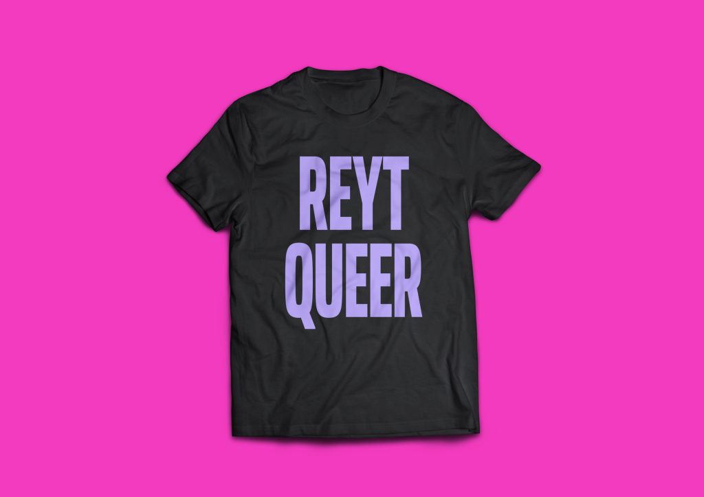 a black short sleeve T shirt with the words Reyt Queer in bold capital, lavender letters in the centre of the chest.