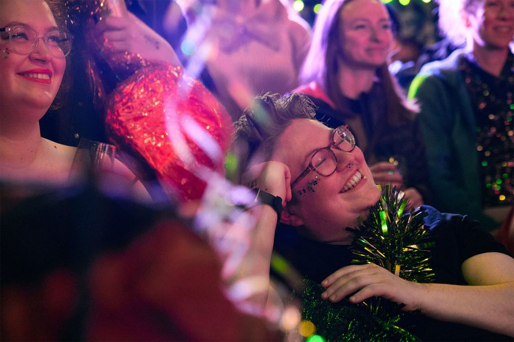 Close up photo of smiling crowd