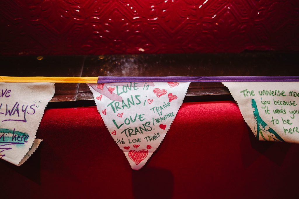 Handmade flags saying love trans people!
